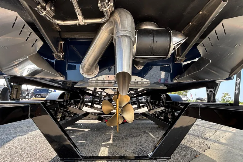 Slide: The Image of Underneath view of 2026 ATX Surf Boats 24 Type-S, showcasing propeller and exhaust system. - 10