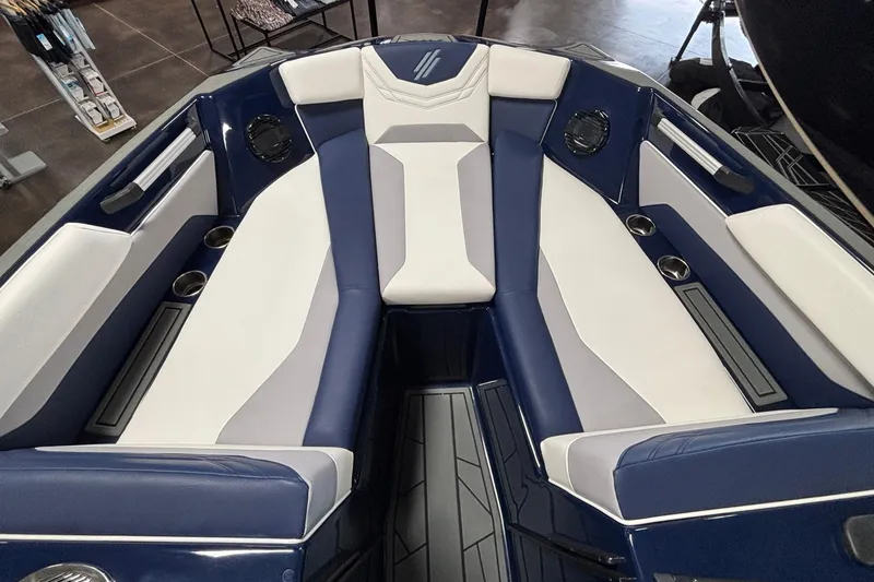 Slide: The Image of 2026 ATX Surf Boats 24 Type-S interior with blue and white seating. - 12