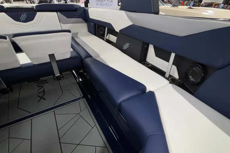 Slide: The Image of 2026 ATX Surf Boats 24 Type-S interior with blue and white seating, modern design. - 18