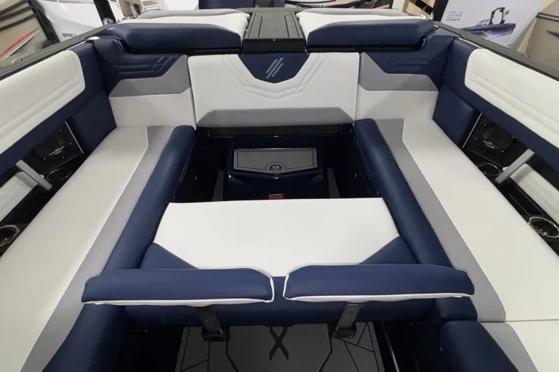 Slide: The Image of 2026 ATX Surf Boats 24 Type-S interior with blue and white seating. - 19