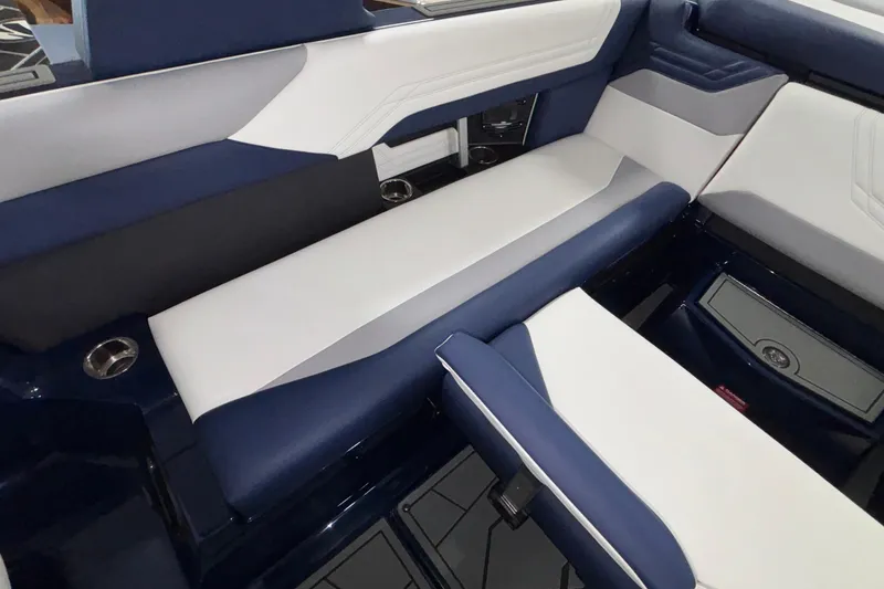 Slide: The Image of 2026 ATX Surf Boats 24 Type-S interior with blue and white seating. - 20