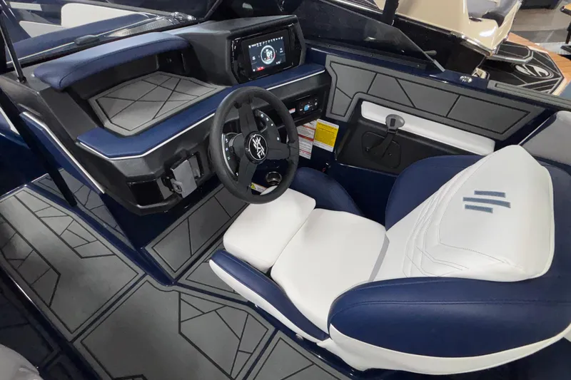 Slide: The Image of 2026 ATX Surf Boats 24 Type-S interior with modern dashboard and steering wheel. - 21