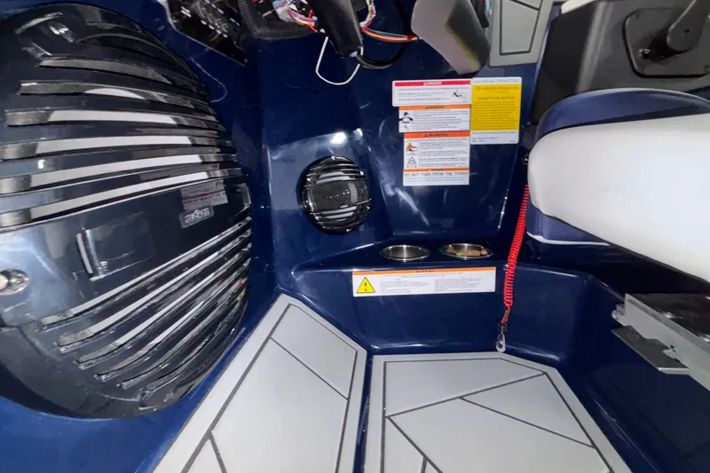 Slide: The Image of Interior of 2026 ATX Surf Boats 24 Type-S, featuring speaker and safety instructions. - 23