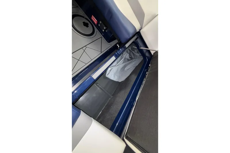 Slide: The Image of 2026 ATX Surf Boats 24 Type-S interior storage compartment with sleek design and ample space. - 32