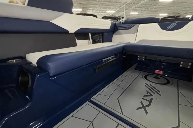 Slide: The Image of 2026 ATX Surf Boats 24 Type-S interior with blue and white seating and custom flooring. - 34