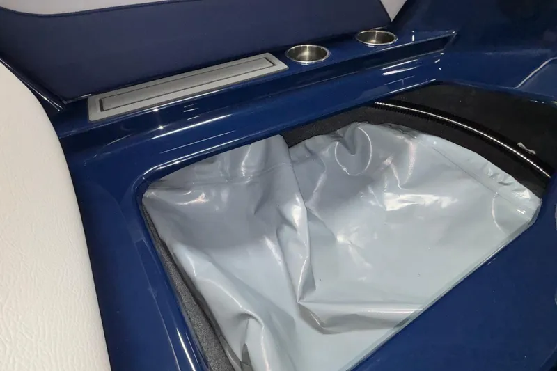 Slide: The Image of 2026 ATX Surf Boats 24 Type-S interior storage compartment with cup holders and sleek design. - 39