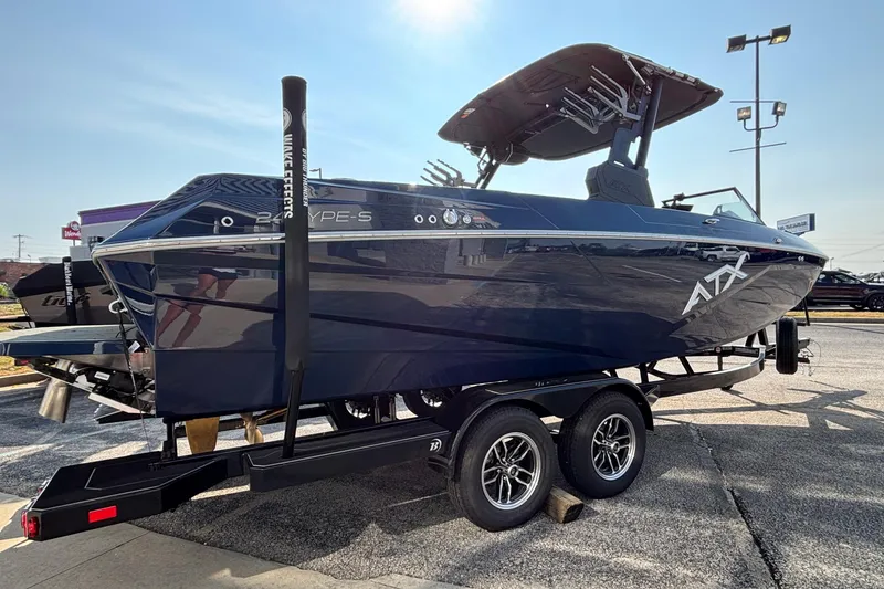 Slide: The Image of 2026 ATX Surf Boats 24 Type-S on trailer, sleek design, sunny day. - 5