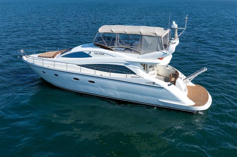 Slide: The Image of 2005 Aicon Yachts 56 Flybridge cruising on open water. - 20