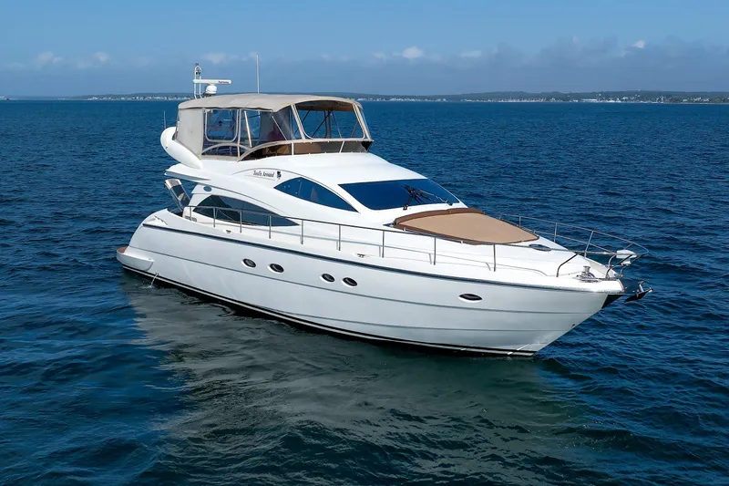 Slide: The Image of Aicon Yachts 56 Flybridge 2005 cruising on open water under clear skies. - 3