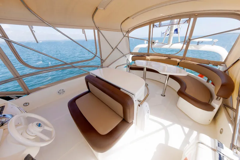 Slide: The Image of Luxurious 2005 Aicon Yachts 56 Flybridge interior with elegant seating and ocean view. - 32