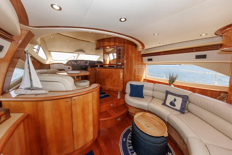 Slide: The Image of Luxurious interior of 2005 Aicon Yachts 56 Flybridge with elegant wood finishes and plush seating. - 34