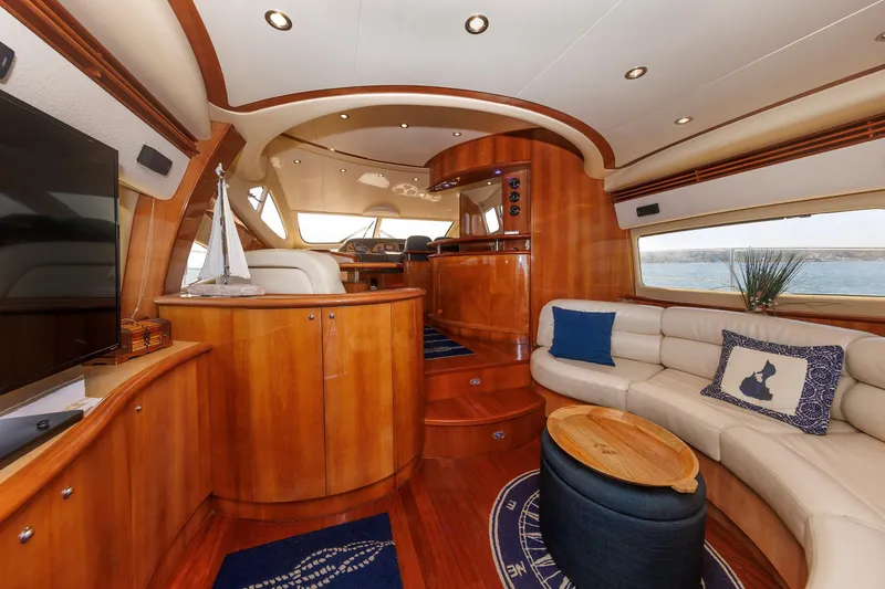 Slide: The Image of Luxurious interior of 2005 Aicon Yachts 56 Flybridge with elegant wood finish and plush seating. - 35