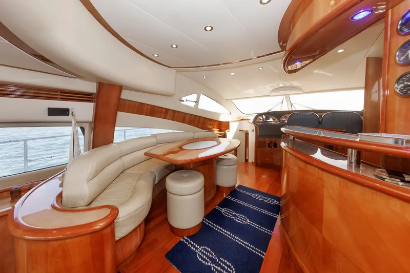 Slide: The Image of Luxurious interior of 2005 Aicon Yachts 56 Flybridge with elegant wood finishes and plush seating. - 36
