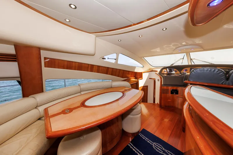Slide: The Image of Luxurious interior of 2005 Aicon Yachts 56 Flybridge with elegant wood finishes and plush seating. - 38