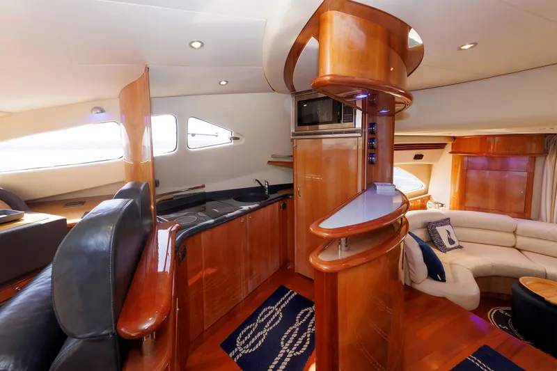 Slide: The Image of Luxurious interior of 2005 Aicon Yachts 56 Flybridge with modern kitchen and seating area. - 40