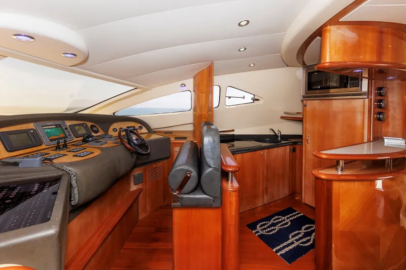Slide: The Image of Luxurious interior of 2005 Aicon Yachts 56 Flybridge with modern helm and kitchenette. - 41