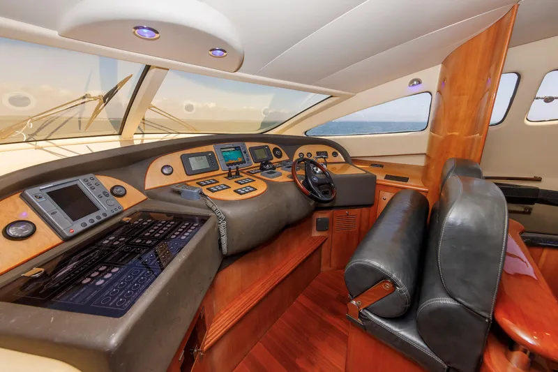 Slide: The Image of Luxurious 2005 Aicon Yachts 56 Flybridge helm with advanced navigation systems and leather seating. - 43