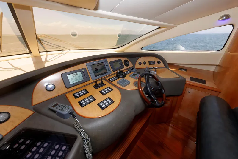 Slide: The Image of Helm of 2005 Aicon Yachts 56 Flybridge with navigation instruments and steering wheel. - 44