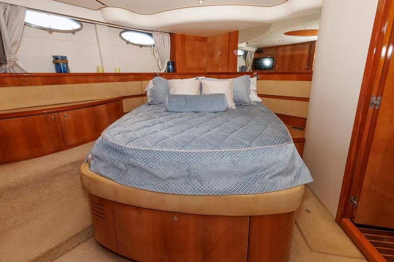 Slide: The Image of Luxurious bedroom interior of 2005 Aicon Yachts 56 Flybridge with elegant wood finishes. - 46