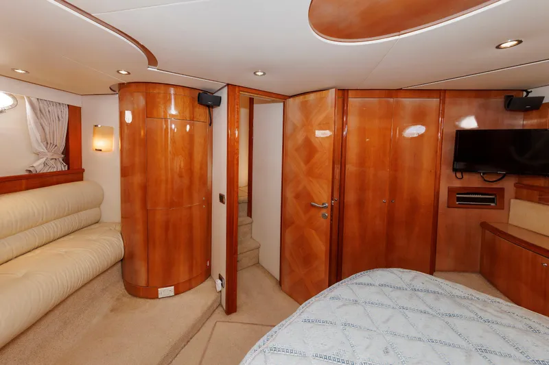 Slide: The Image of Luxurious interior of 2005 Aicon Yachts 56 Flybridge with wood paneling and modern amenities. - 49