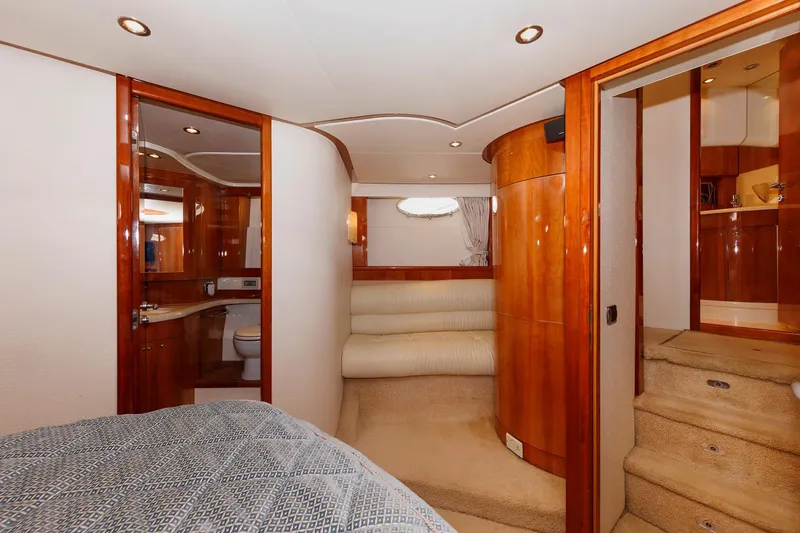 Slide: The Image of Luxurious interior of 2005 Aicon Yachts 56 Flybridge, featuring wood finishes and cozy seating. - 51