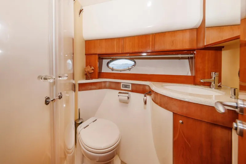 Slide: The Image of Luxurious bathroom in 2005 Aicon Yachts 56 Flybridge, featuring wood accents and modern fixtures. - 53
