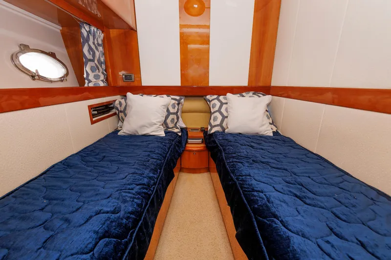 Slide: The Image of Twin cabin with blue bedding in 2005 Aicon Yachts 56 Flybridge. - 55