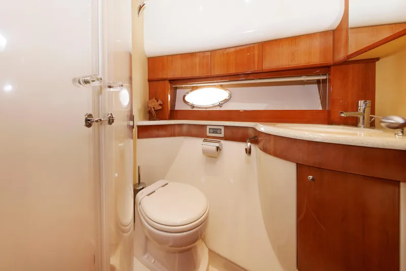 Slide: The Image of Luxurious bathroom in 2005 Aicon Yachts 56 Flybridge, featuring elegant wood finishes. - 57