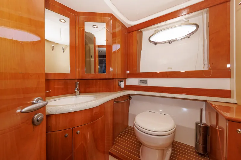 Slide: The Image of Luxurious bathroom in 2005 Aicon Yachts 56 Flybridge, featuring wood accents and modern fixtures. - 59