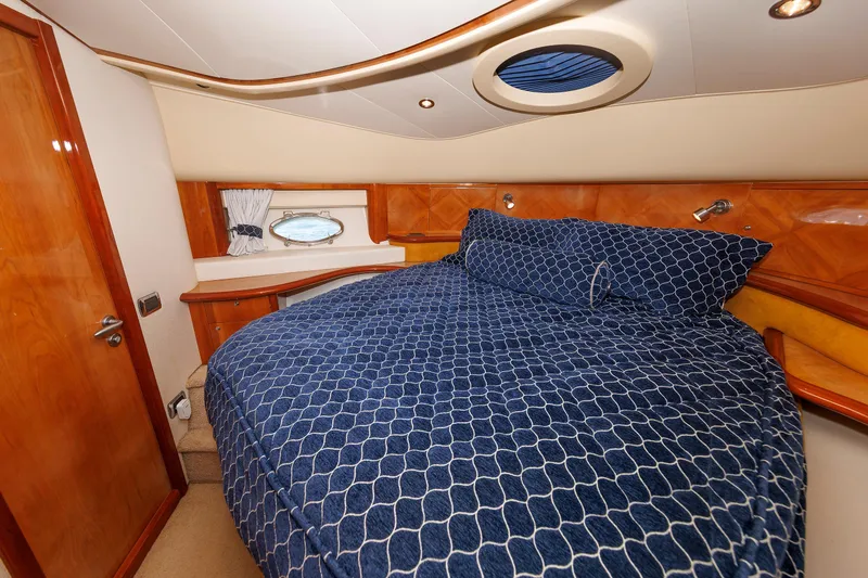Slide: The Image of Luxurious bedroom interior of 2005 Aicon Yachts 56 Flybridge with blue bedding. - 61
