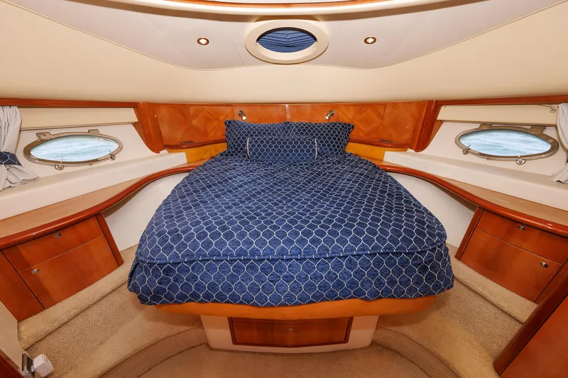 Slide: The Image of Luxurious cabin interior of 2005 Aicon Yachts 56 Flybridge with elegant wood finish. - 62