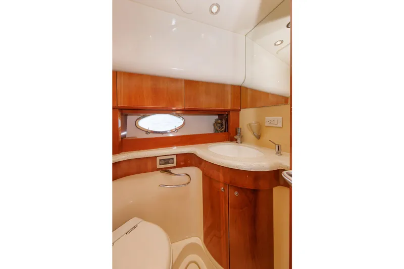 Slide: The Image of Luxurious bathroom in 2005 Aicon Yachts 56 Flybridge, featuring elegant wood finishes and modern fixtures. - 63