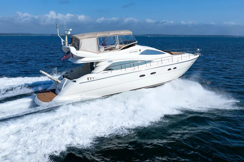 Slide: The Image of Aicon Yachts 56 Flybridge 2005 cruising on open sea, creating waves. - 8