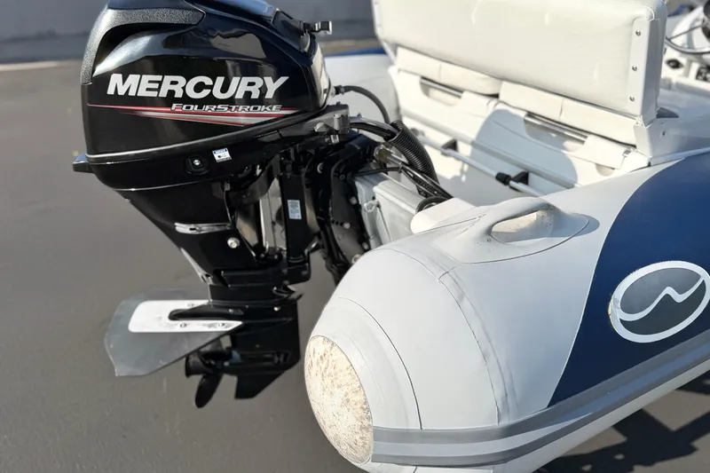 Slide: The Image of Walker Bay Genisis 310 boat with Mercury FourStroke engine, 2015 model. - 12