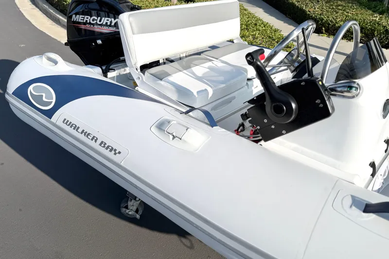Slide: The Image of 2015 Walker Bay Genisis 310 inflatable boat with Mercury outboard motor. - 17