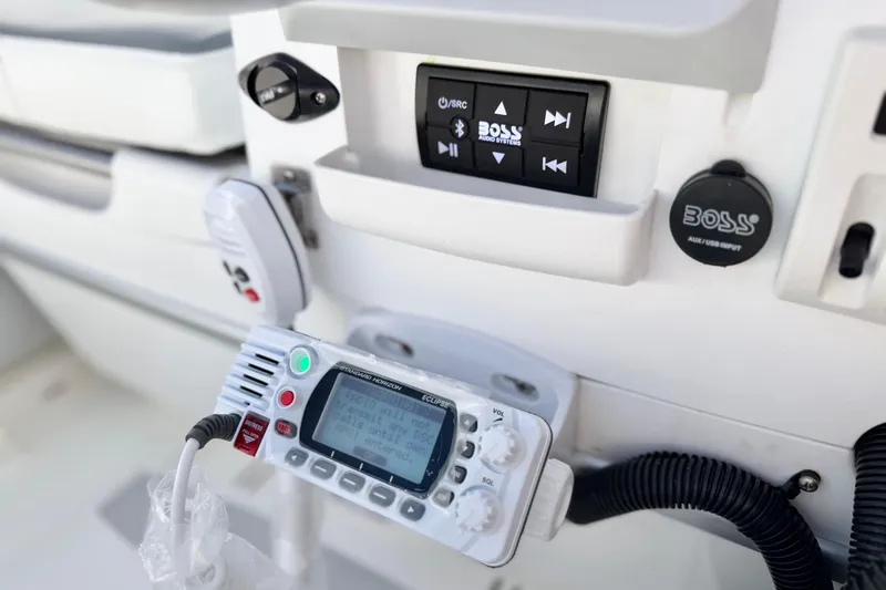 Slide: The Image of Control panel of a 2015 Walker Bay Genisis 310 boat with audio and communication systems. - 22