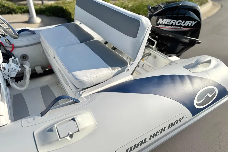 Slide: The Image of 2015 Walker Bay Genisis 310 inflatable boat with Mercury outboard motor. - 7