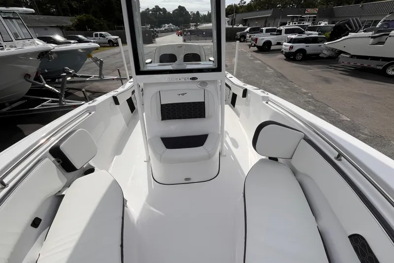 Slide: The Image of 2026 Tidewater 220 LXF boat interior with white seating and modern design. - 11