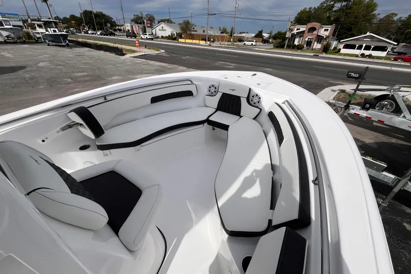 Slide: The Image of 2026 Tidewater 220 LXF boat interior with white seating and black accents. - 12