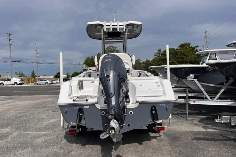 Slide: The Image of 2026 Tidewater 220 LXF boat with Yamaha 200 outboard motor, parked on a lot. - 3