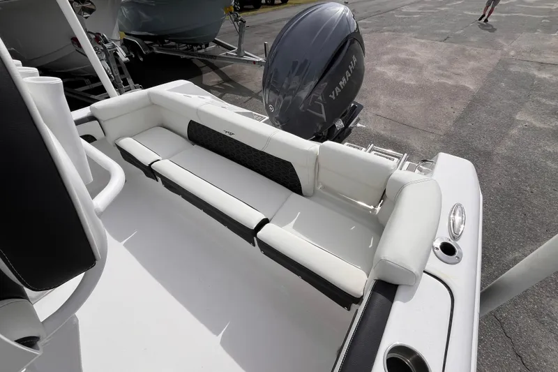 Slide: The Image of 2026 Tidewater 220 LXF boat with Yamaha engine, featuring sleek white seating. - 6