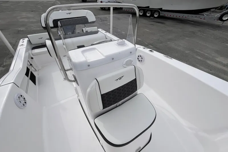 Slide: The Image of 2026 Tidewater 180 CC Adventure boat interior with sleek seating and console design. - 10
