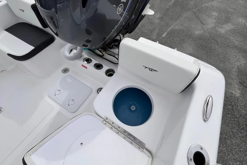 Slide: The Image of 2026 Tidewater 180 CC Adventure boat interior with motor and storage compartments. - 12