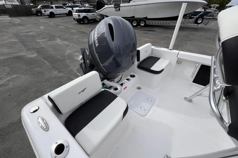 Slide: The Image of 2026 Tidewater 180 CC Adventure boat interior with Yamaha engine, docked in a marina. - 5