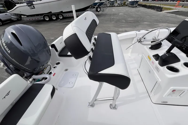 Slide: The Image of 2026 Tidewater 180 CC Adventure boat interior with Yamaha engine and steering console. - 6