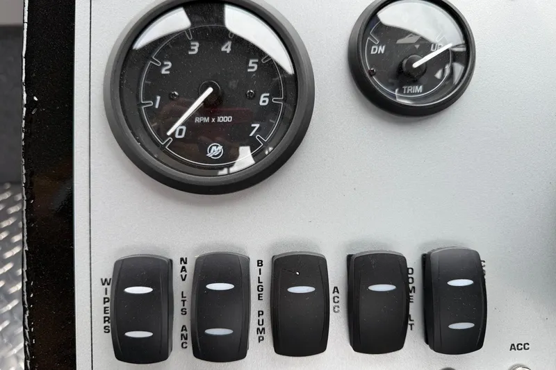 Slide: The Image of Dashboard controls of 2026 Thunder Jet 185 Luxor boat, featuring RPM gauge and switches. - 13