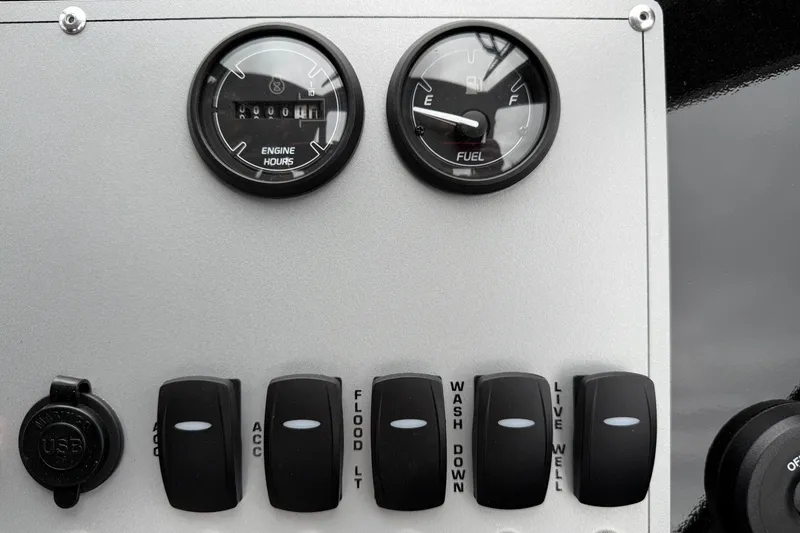 Slide: The Image of Control panel of 2026 Thunder Jet 185 Luxor with gauges and switches. - 14