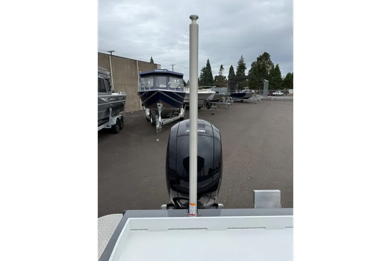 Slide: The Image of 2026 Thunder Jet 185 Luxor boat with outboard motor in a parking lot. - 22