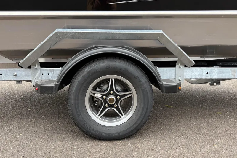 Slide: The Image of Trailer wheel of 2026 Thunder Jet 185 Luxor boat on asphalt surface. - 30