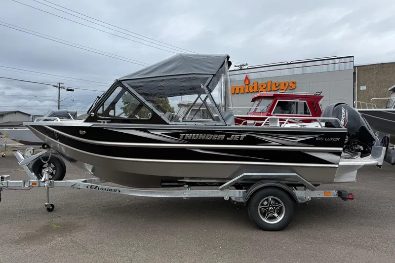 Slide: The Image of 2026 Thunder Jet 185 Luxor boat on trailer, parked outside Midgleys store. - 4